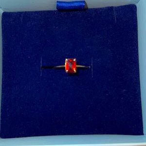 Red emerald cut garnet ring in solid 10k yellow gold.